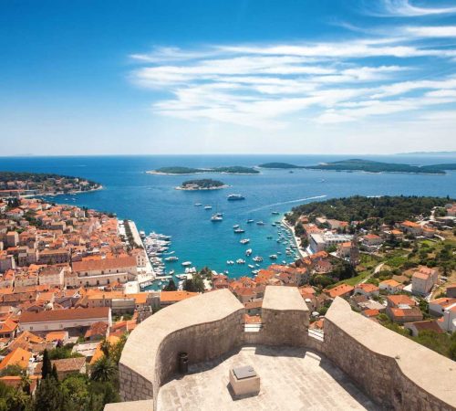 Wide angle aerial view of Hvar city and the bay from the Spanish fortress