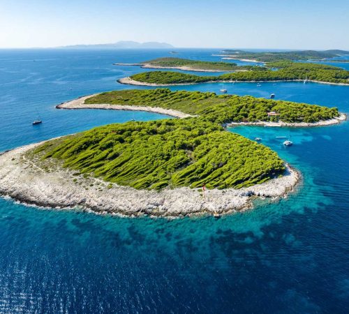 Turquoise sea and circular green islands in Croatia